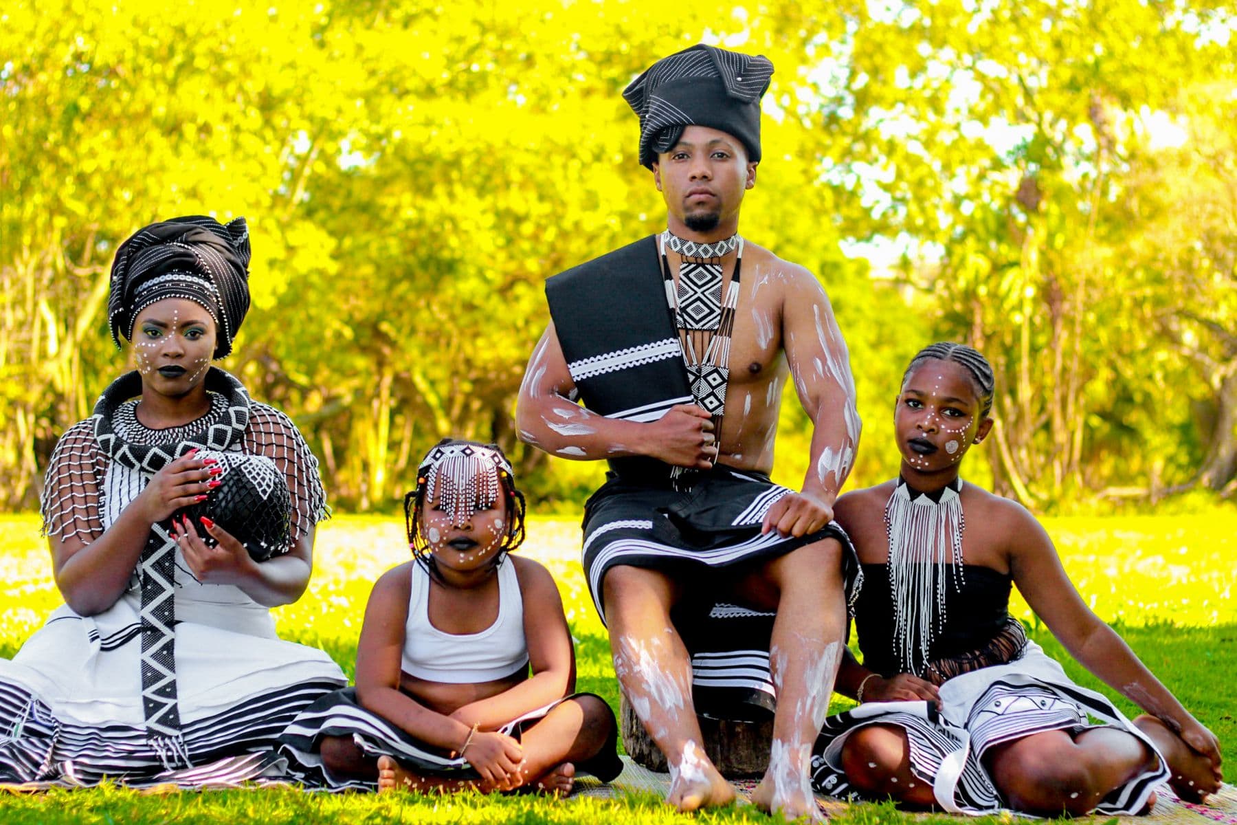 A family in traditional Xhosa attire outdoors in East London, Eastern Cape.